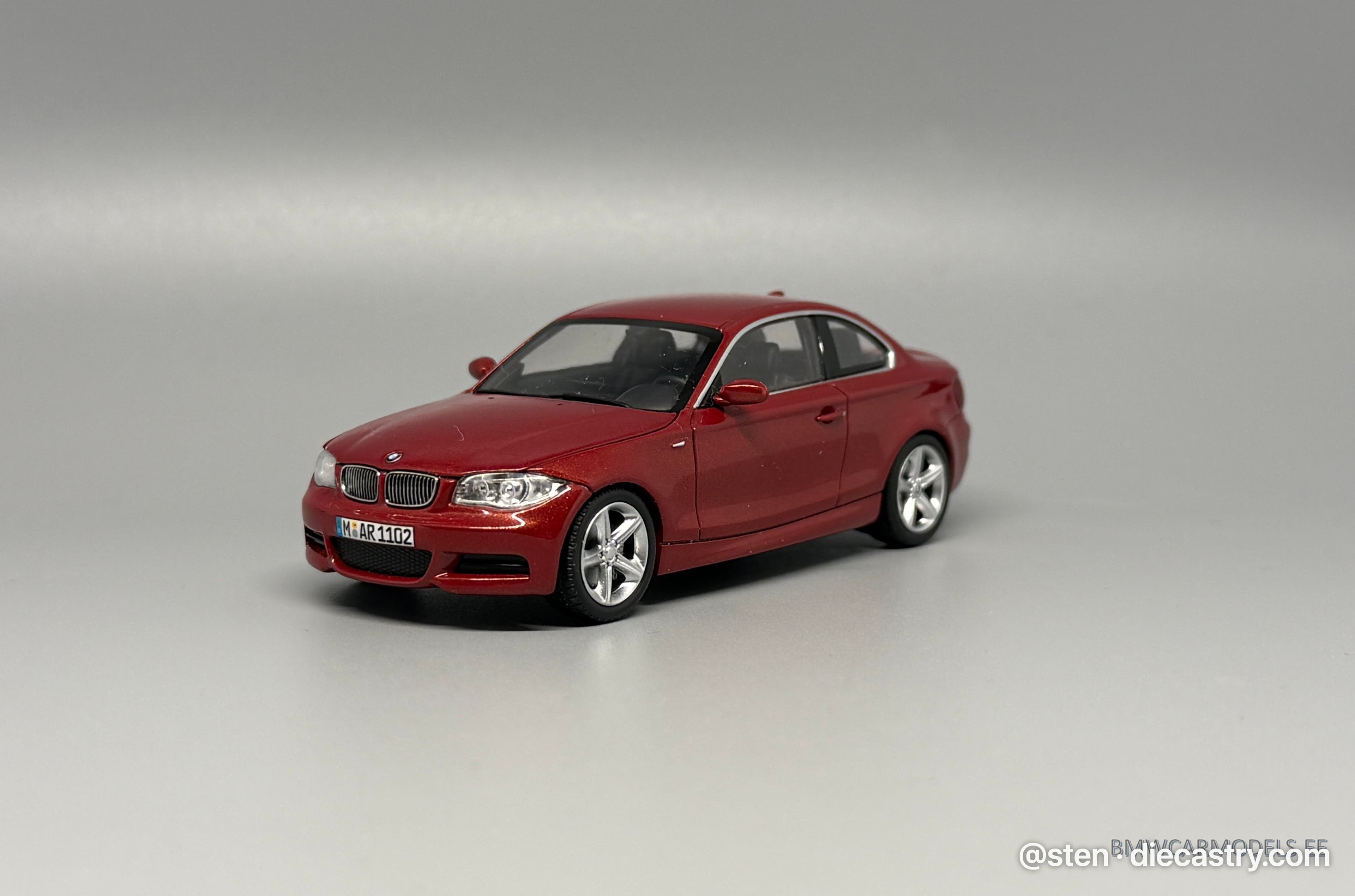 2007 BMW 1 Series Coupe (E82) 1:43 scale diecast model by Minichamps in Sedona Red Metallic