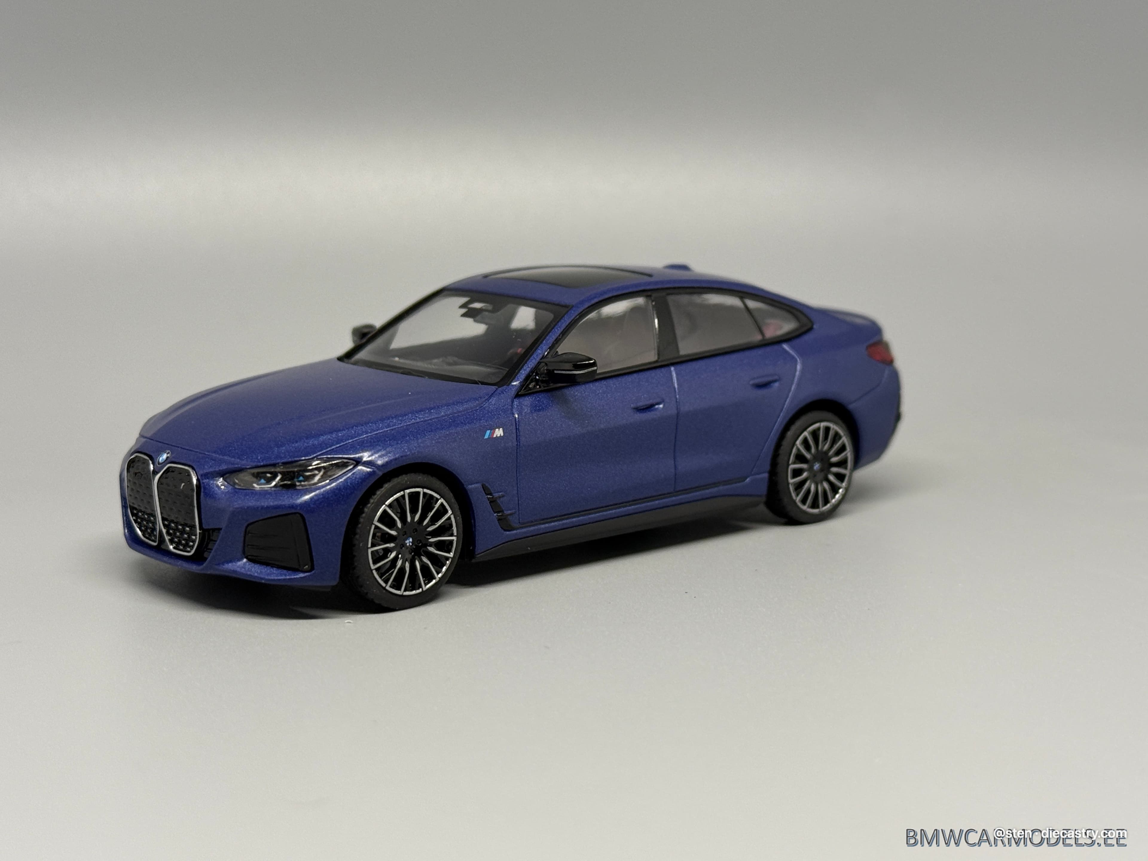 2022 BMW i4 M50 1:43 scale diecast model by Minichamps in Frozen Portimao Blue metallic