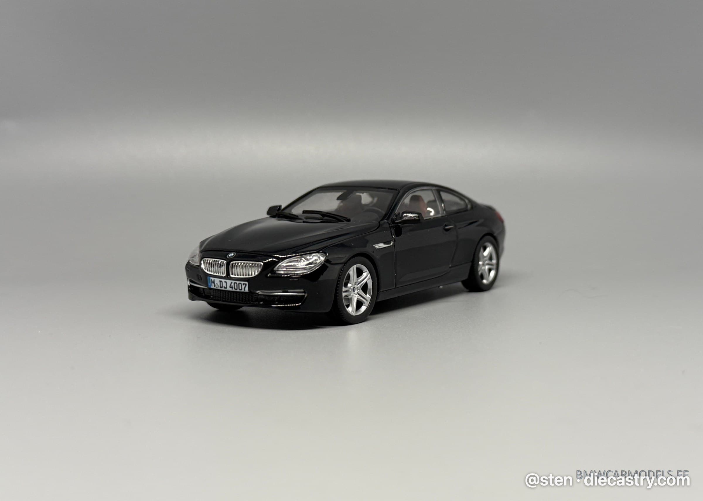 2011 BMW 650i Coupe (F13) 1:43 scale diecast model by Paragon Models in Deep Sea Blue Metal