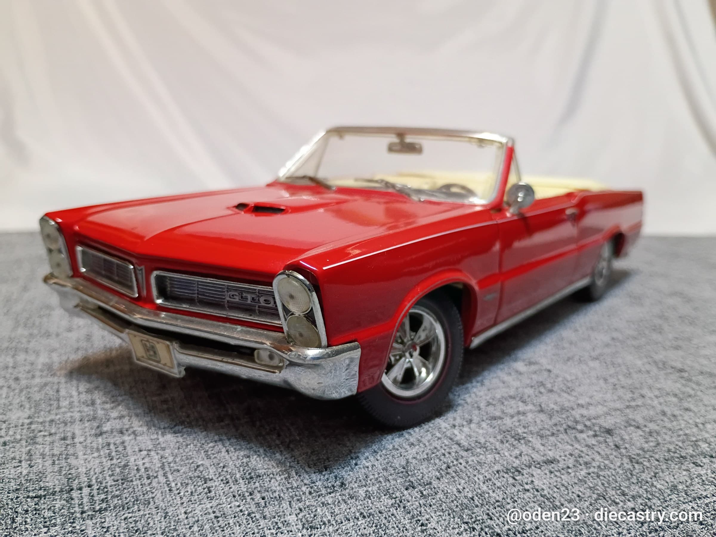 1965 Pontiac GTO 1:18 scale diecast model by Maisto in Cardinal Red