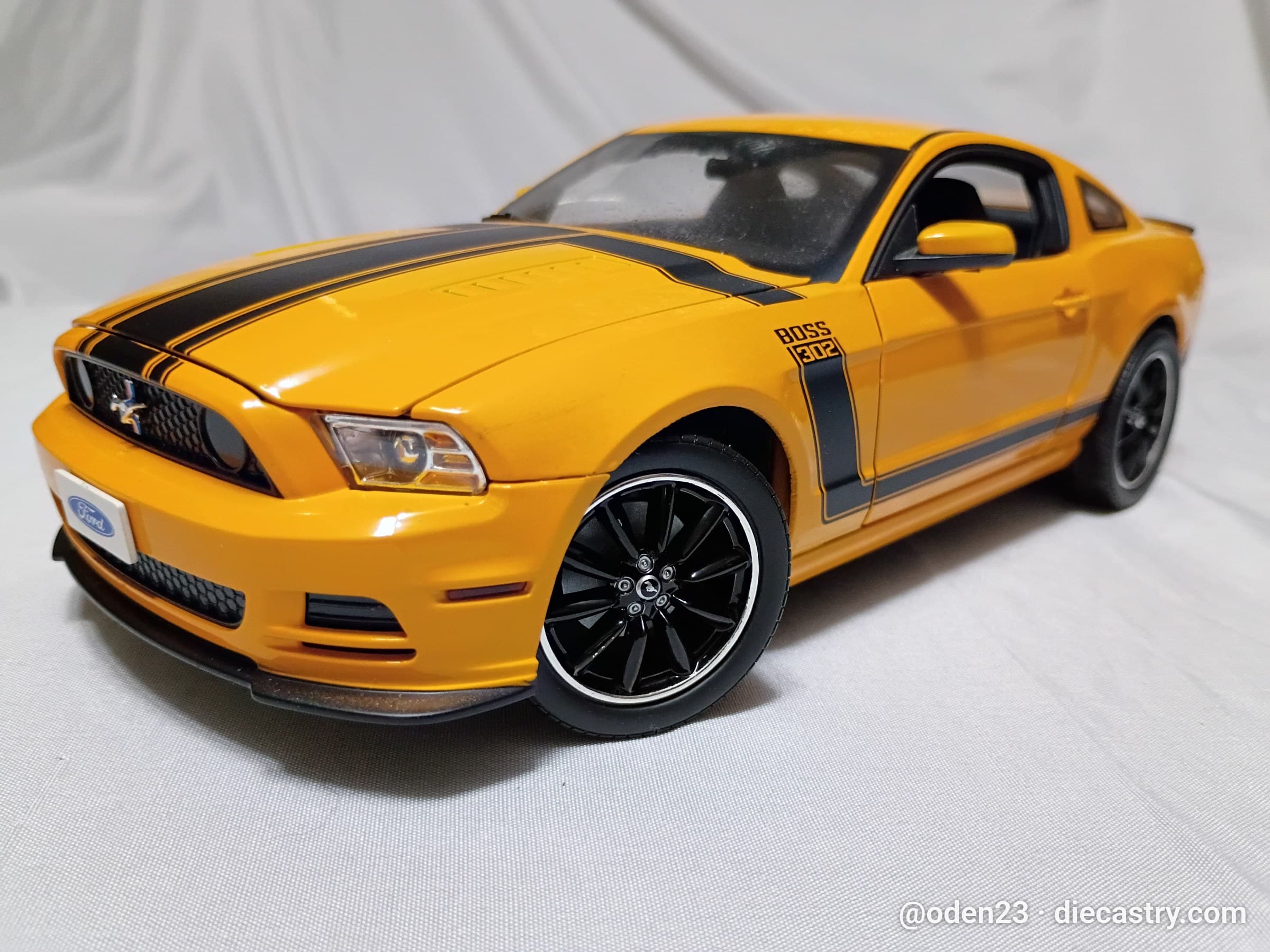 2013 Ford Mustang Boss 302 1:18 scale diecast model by Shelby Collectibles in School Bus Yellow